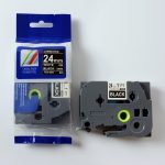 Tz2-355 uzlīmju lente balts uz melna 24mm